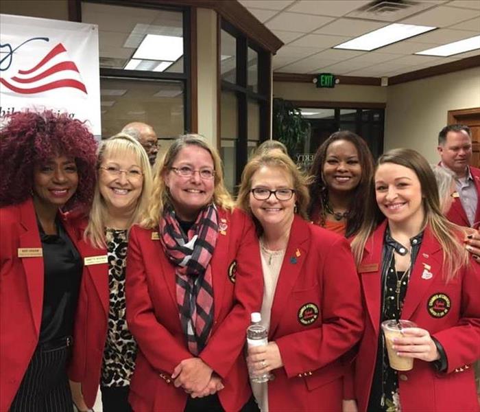 ladies in red coats