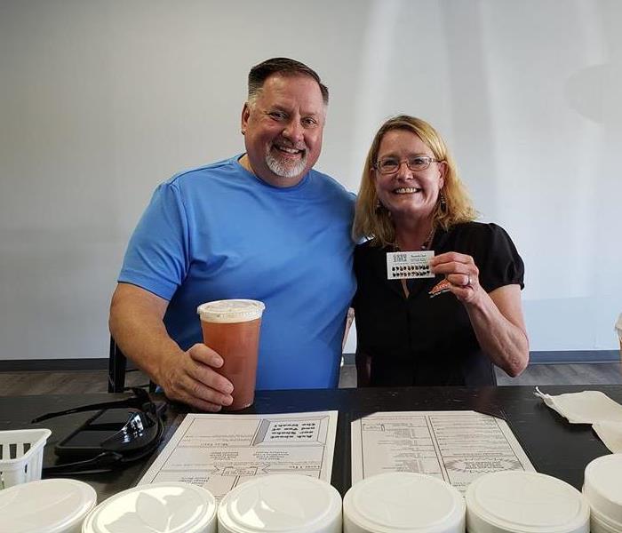 Two adults enjoying iced tea