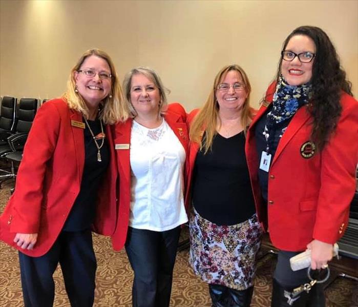 ladies in red coats