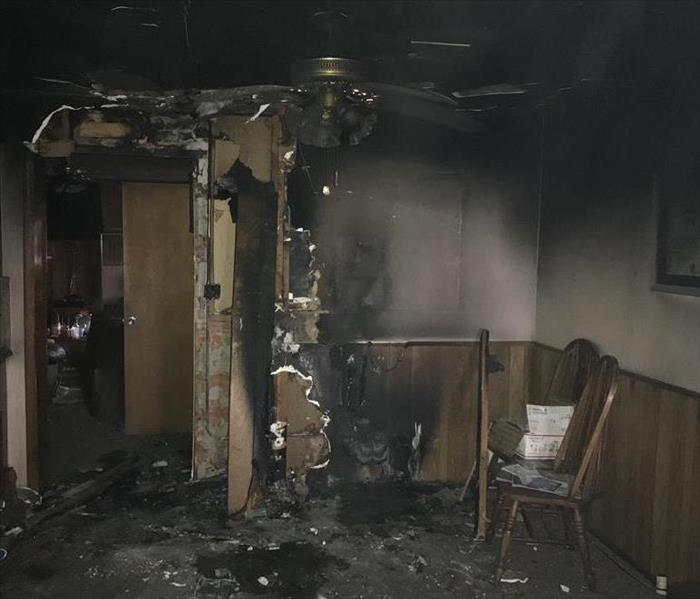 ceiling fan, walls blackened by fire