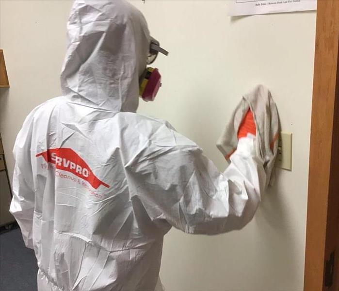 man in white protective suit