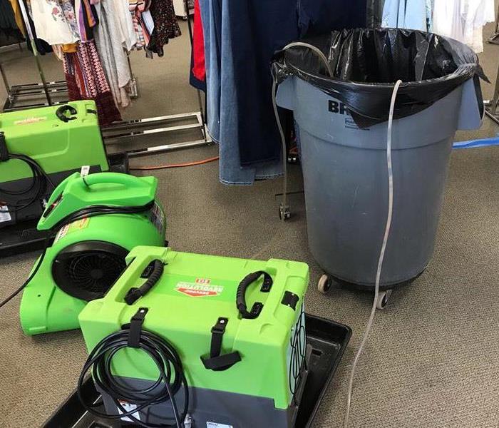 SERVPRO equipment set up in clothing store to dry carpet