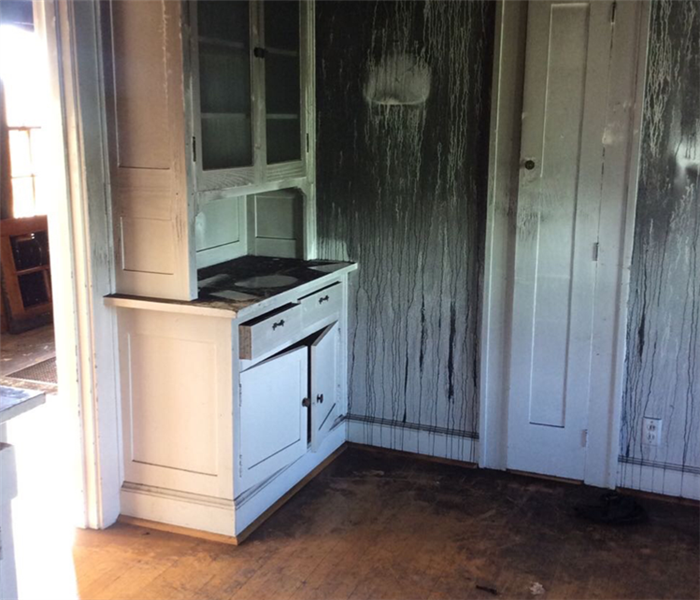 hardwood floor, white cabinets, fire damaged