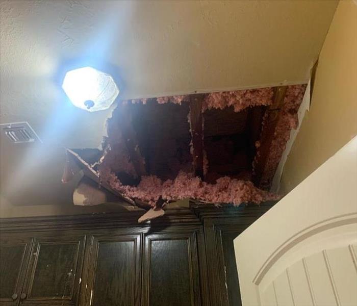 hole in ceiling wet insulation