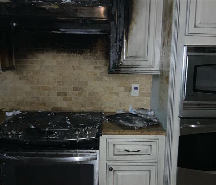 burned kitchen cupboards and stove