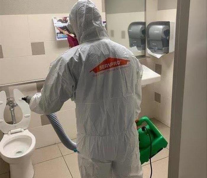 man in white PPE