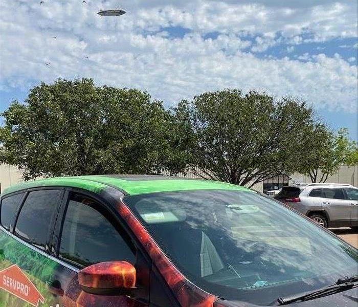 fire and water wrapped car, SERVPRO logo, Goodyear Blimp in sky
